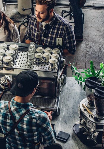 Govinda team members at the espresso counter